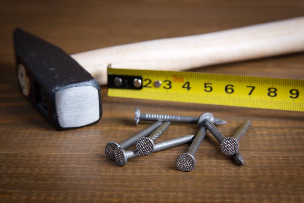 tape measure, hammer and nails