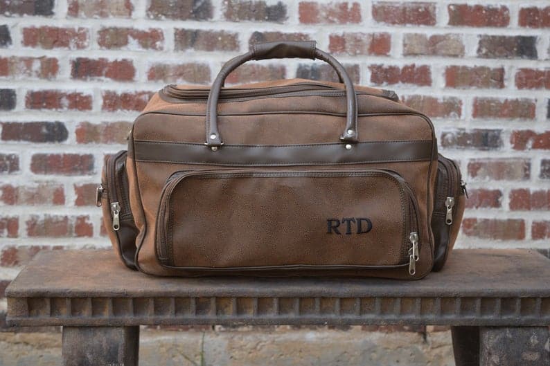 gifts for father of the bride: personalized leather duffle bag