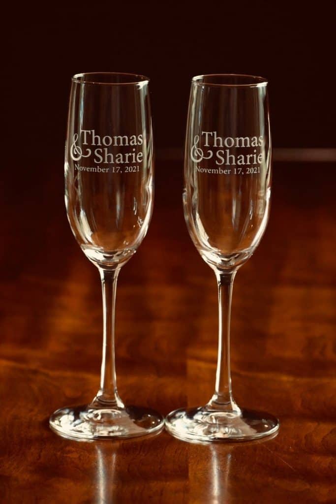 anniversary gifts for parents: Engraved Couple Champagne Flutes