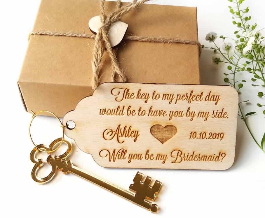 a key with a proposal message for future bridesmaids