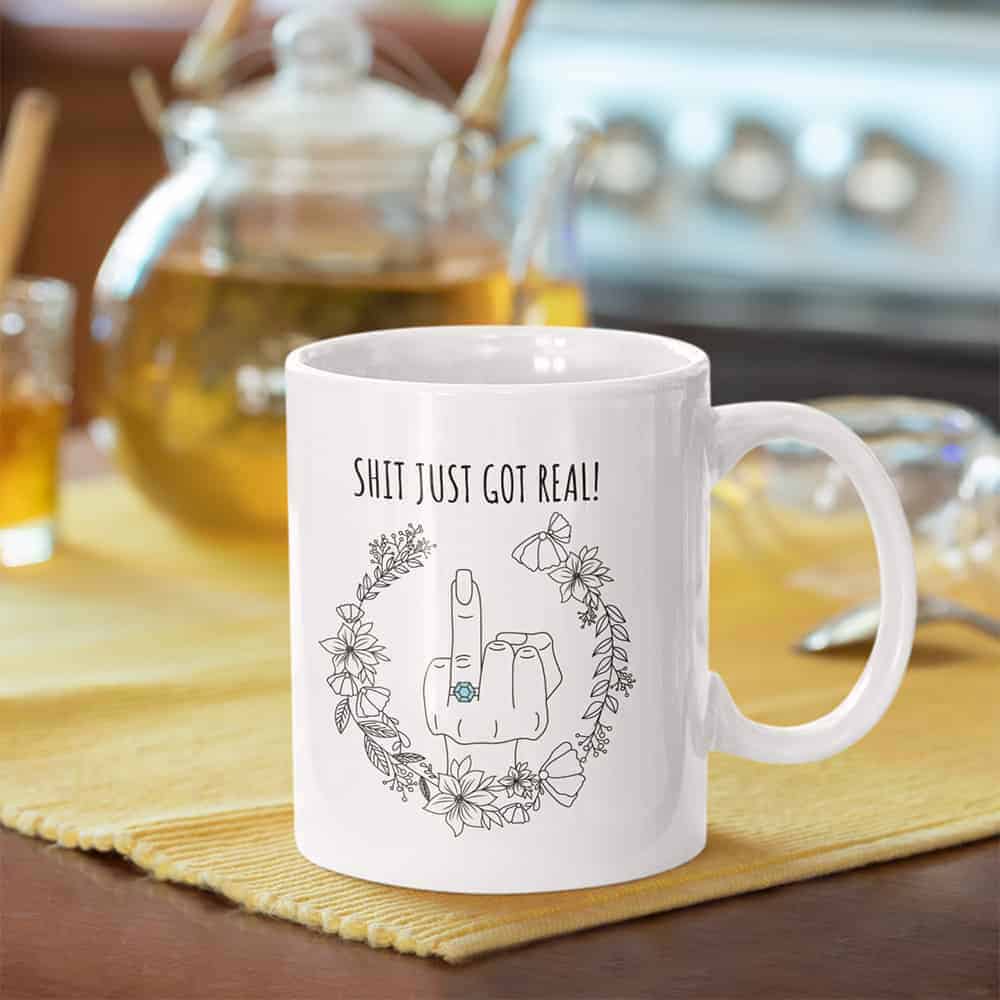 funny gifts for her: “Shit Just Got Real” engagement mug